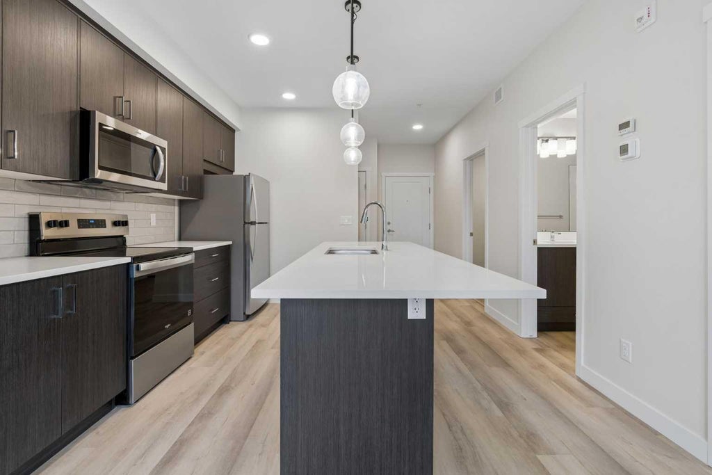 Photo of 655 Shawnee Square SW #309, Calgary, AB T2Y 1E3 (MLS # A2351504)