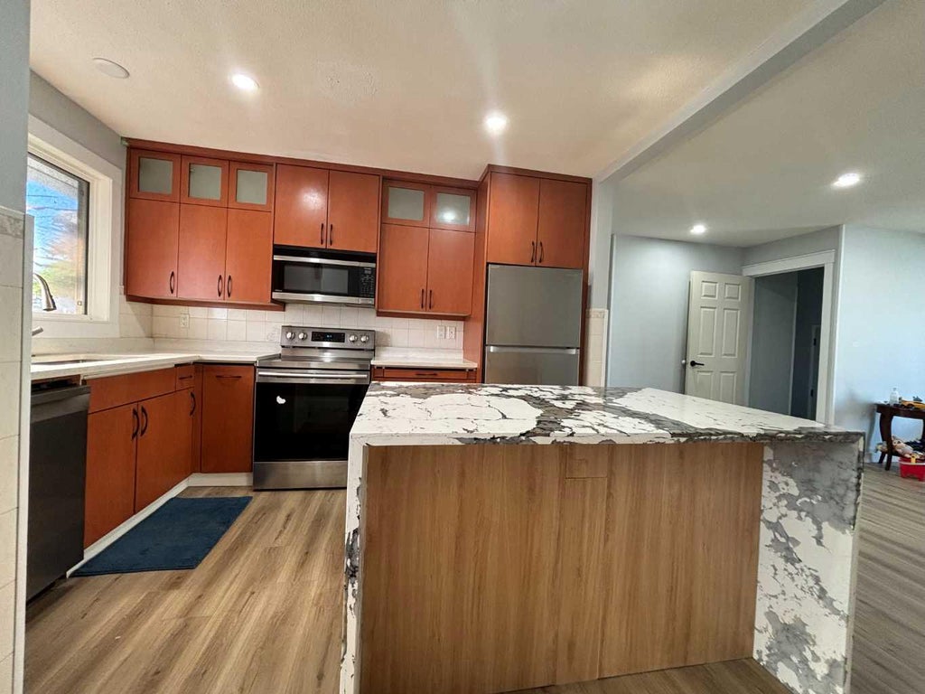 Photo of 1672 Marlyn Way NE, Calgary, AB T2A 3K7 (MLS # A2324575)