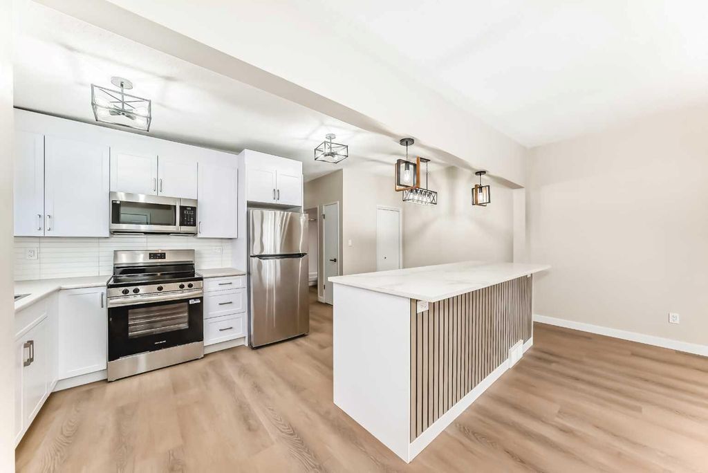 Photo of 7406-7408 Hunterfield Road NW, Calgary, AB T2K 4L1 (MLS # A2276511)