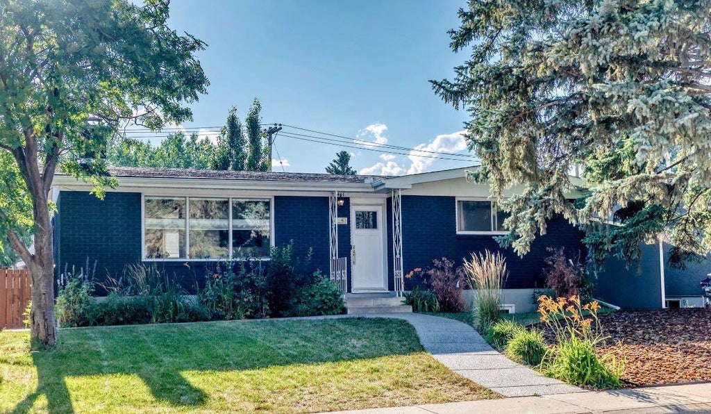 Photo of 411 Woodland Crescent SE, Calgary, AB T2J 1J7 (MLS # A2332815)