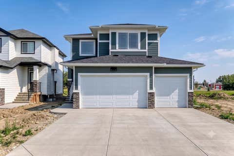 Photo of 707 Mandalay Avenue, Carstairs, AB T0M 0N0 (MLS # A2328888)