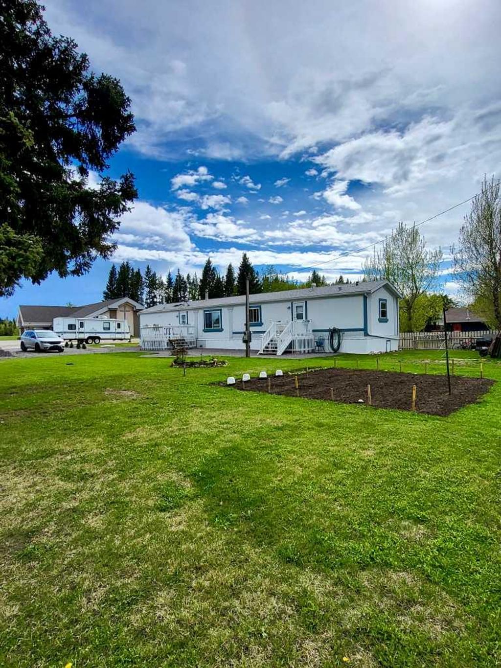 Photo of 106 3 Avenue, Leslieville, AB T0M 1H0 (MLS # A2309351)