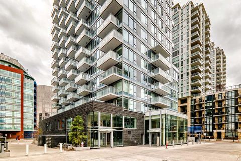 Photo of 108 Waterfront Court SW #104, Calgary, AB T2P 1K7 (MLS # A2308774)