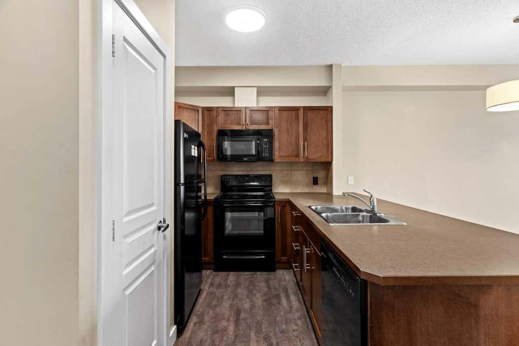 Photo of 10 Panatella Road NW #212, Calgary, AB T3K 0V4 (MLS # A2339765)