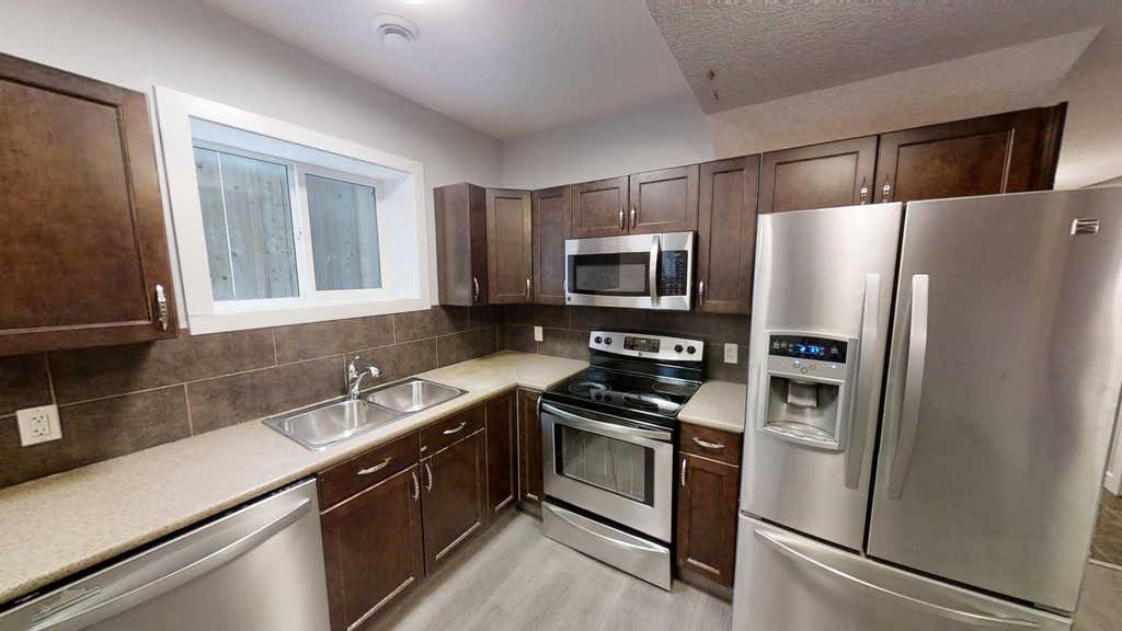 Photo of 8634 88B Street #A, Grande Prairie, AB T8X 0P3 (MLS # A2338959)