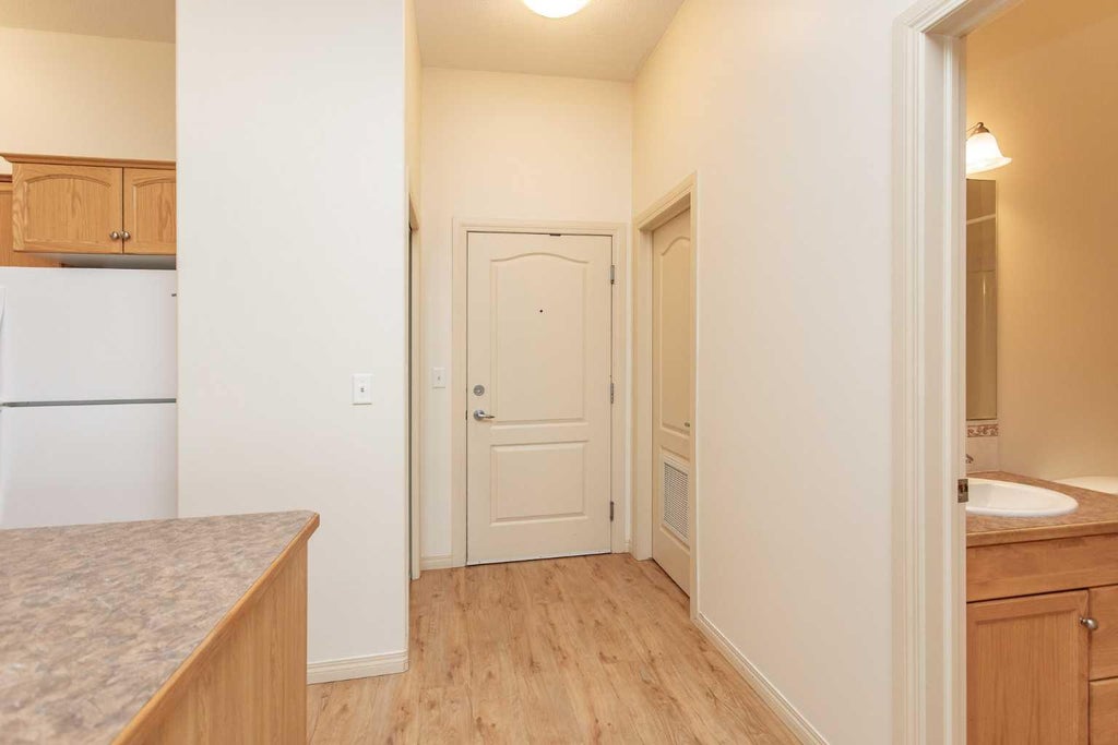 Photo of 4425 HERITAGE Way #105, Lacombe, AB T4L 2P4 (MLS # A2351501)