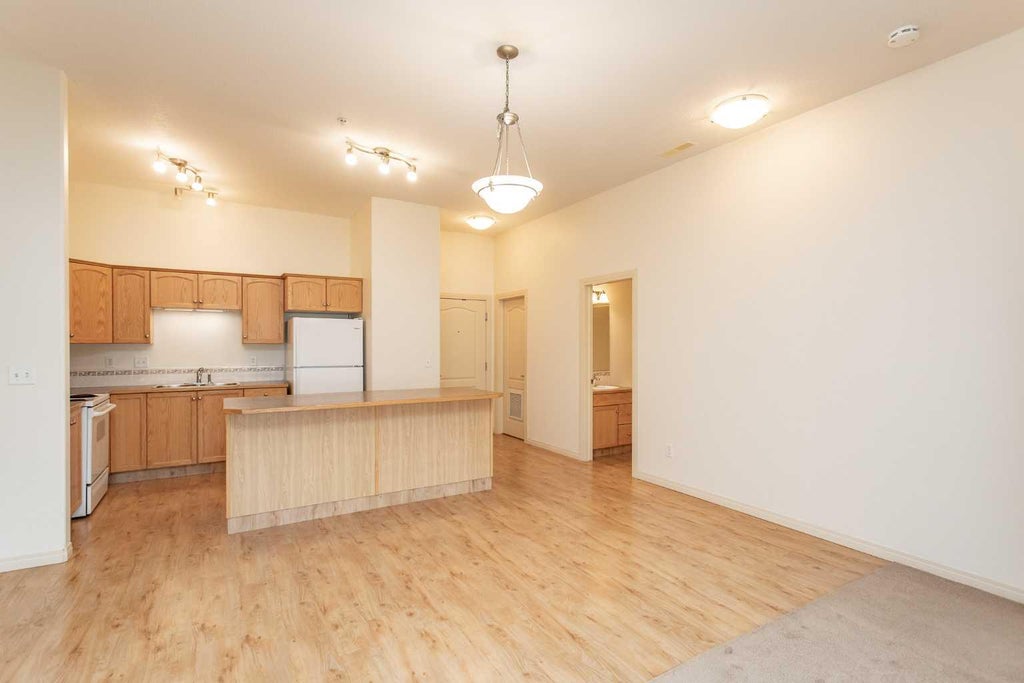 Photo of 4425 HERITAGE Way #105, Lacombe, AB T4L 2P4 (MLS # A2351501)