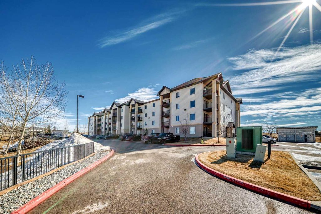 Photo of 304 Mackenzie Way SW #6310, Airdrie, AB T4B 3H6 (MLS # A2294862)