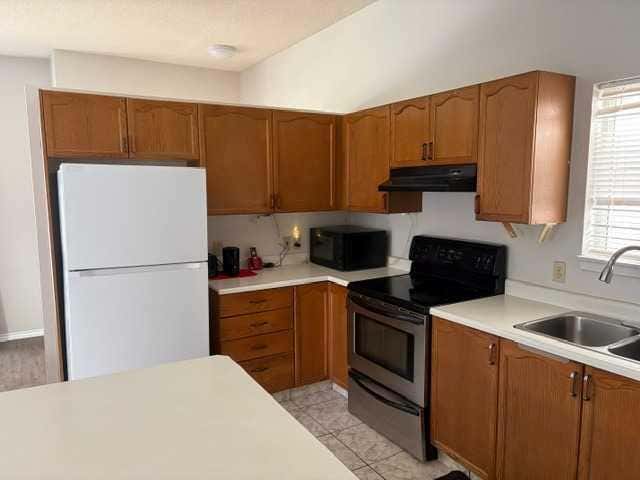 Photo of 6934 Laguna Way NE, Calgary, AB T1Y 6W2 (MLS # A2320961)