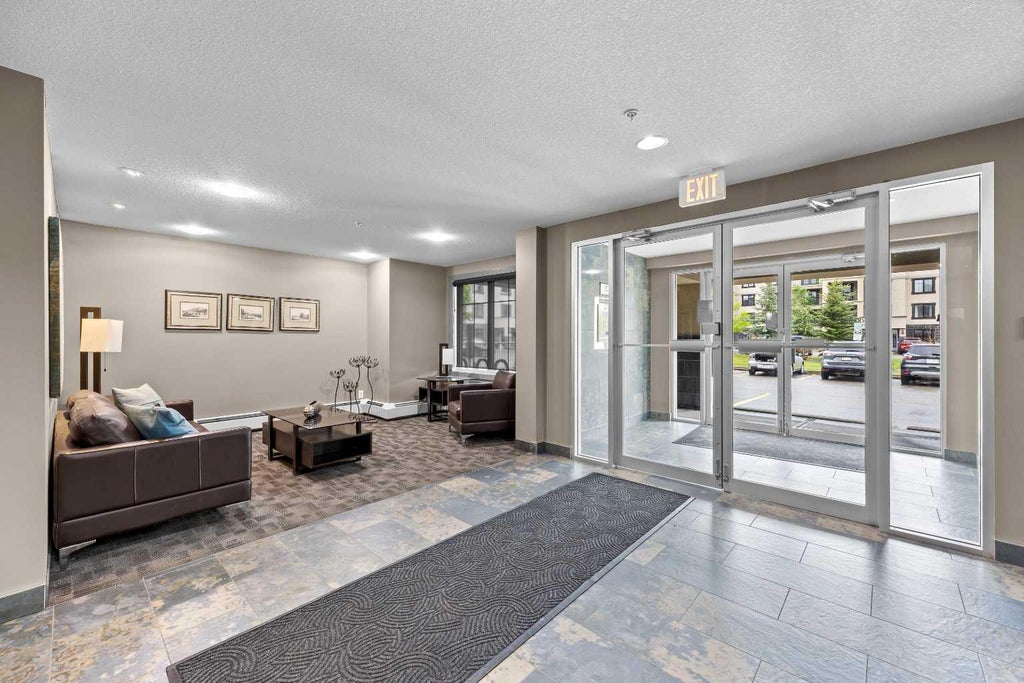 Photo of 310 McKenzie Towne Gate SE #1213, Calgary, AB T2Z 1A6 (MLS # A2316535)