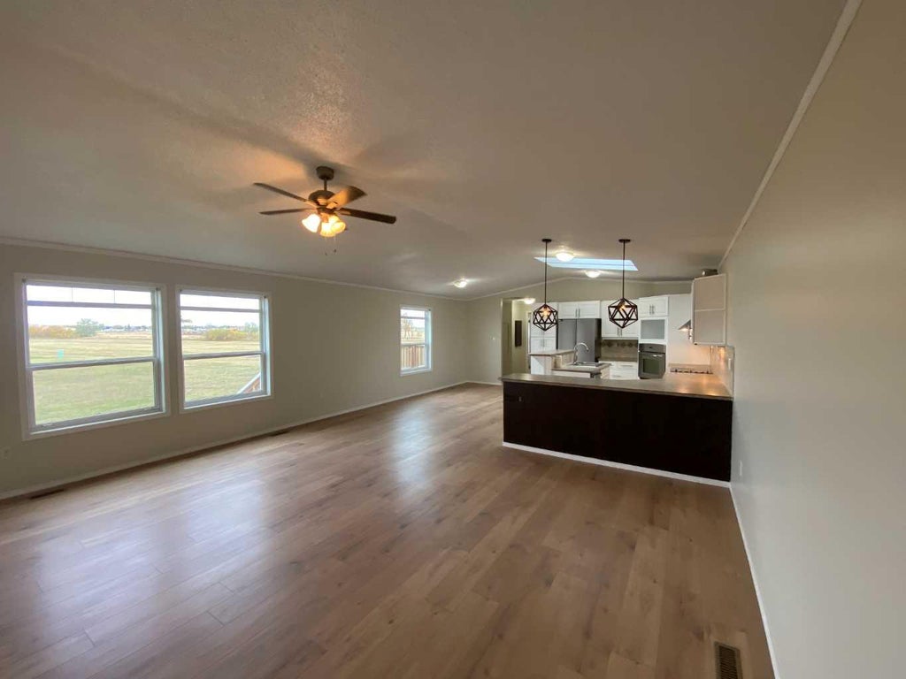 Photo of 127 Meadowplace Drive E, Brooks, AB T1R 0X1 (MLS # A2351216)