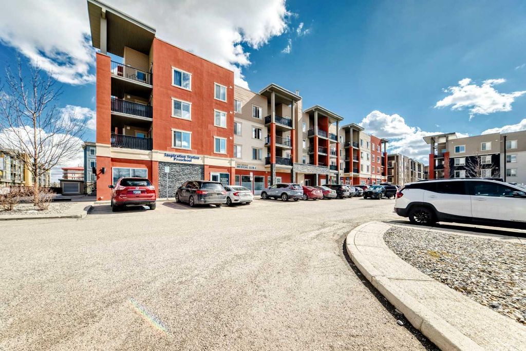 Photo of 403 Mackenzie Way SW #1305, Airdrie, AB T4B 3V7 (MLS # A2300210)