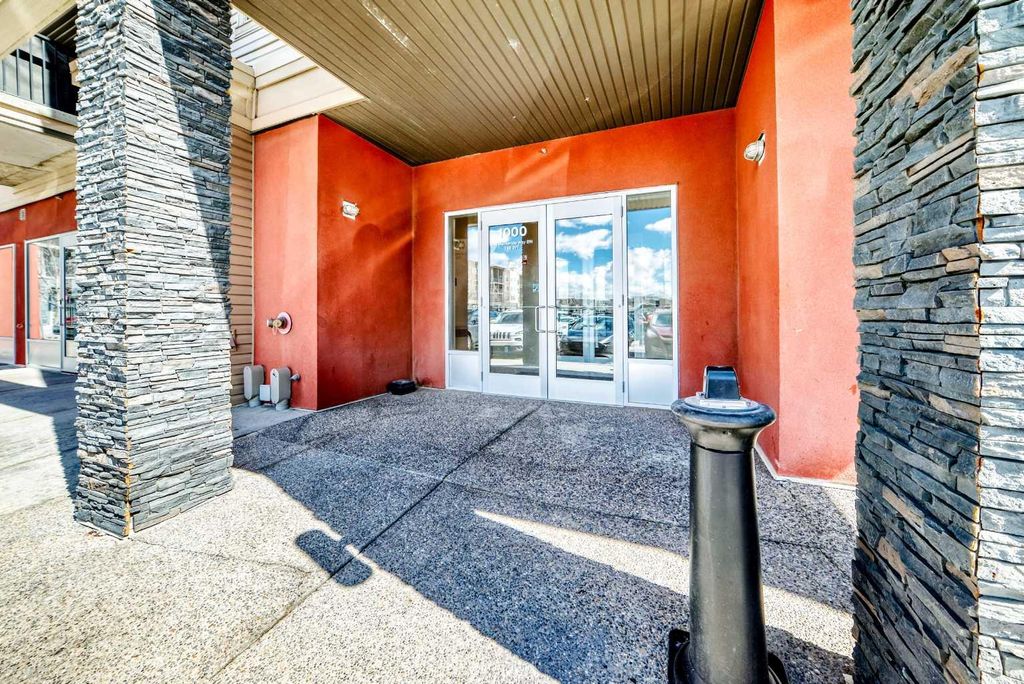 Photo of 403 Mackenzie Way SW #1305, Airdrie, AB T4B 3V7 (MLS # A2300210)