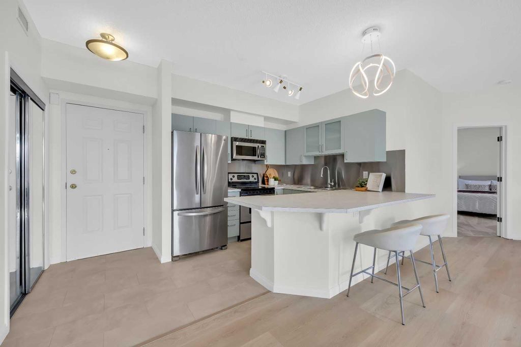 Photo of 527 15 Avenue SW #301, Calgary, AB T2R 1R5 (MLS # A2300930)