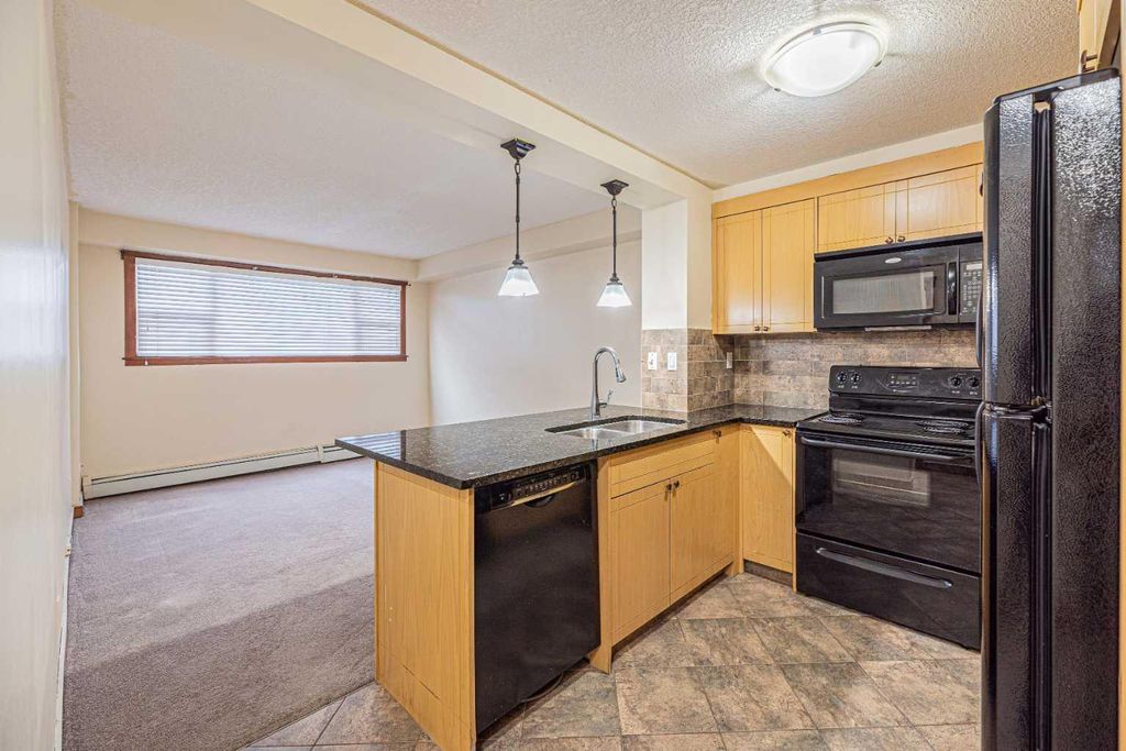 Photo of 920 68 Avenue SW #111, Calgary, AB T2V 0N6 (MLS # A2294959)