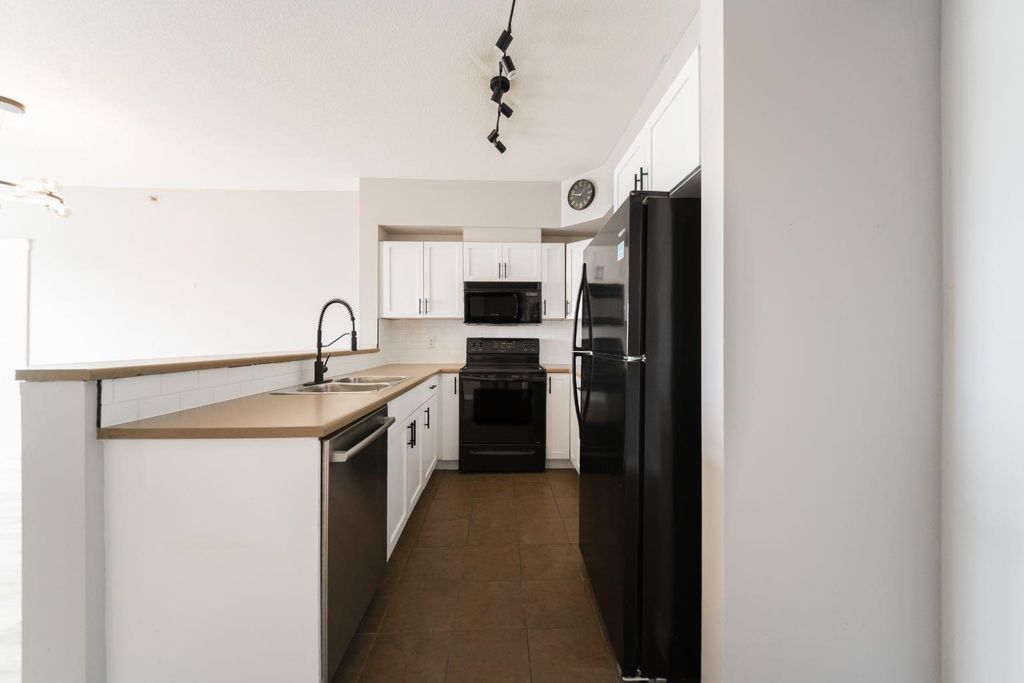 Photo of 108 Denholm Gate #409, Fort McMurray, AB T9H 0B3 (MLS # A2311983)