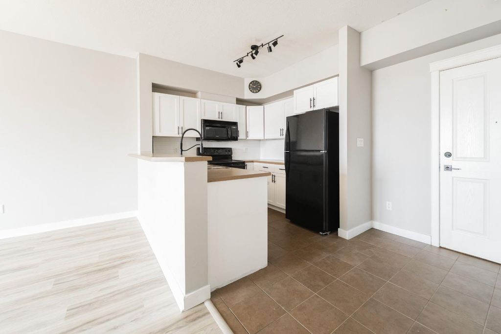 Photo of 108 Denholm Gate #409, Fort McMurray, AB T9H 0B3 (MLS # A2311983)