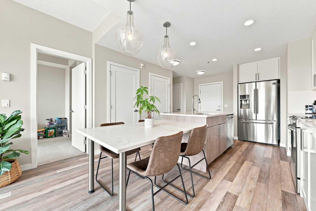 Photo of 8530 8A Avenue SW #320, Calgary, AB T3H 6A7 (MLS # A2347833)