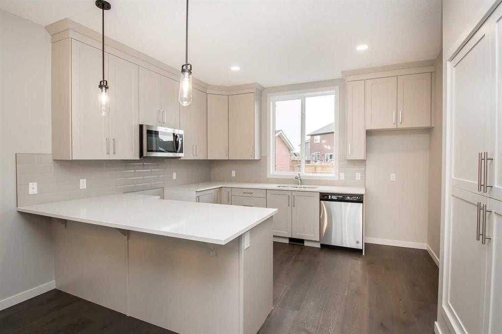 Photo of 504 Kitstone Gate, Carstairs, AB T0M 0N0 (MLS # A2310928)
