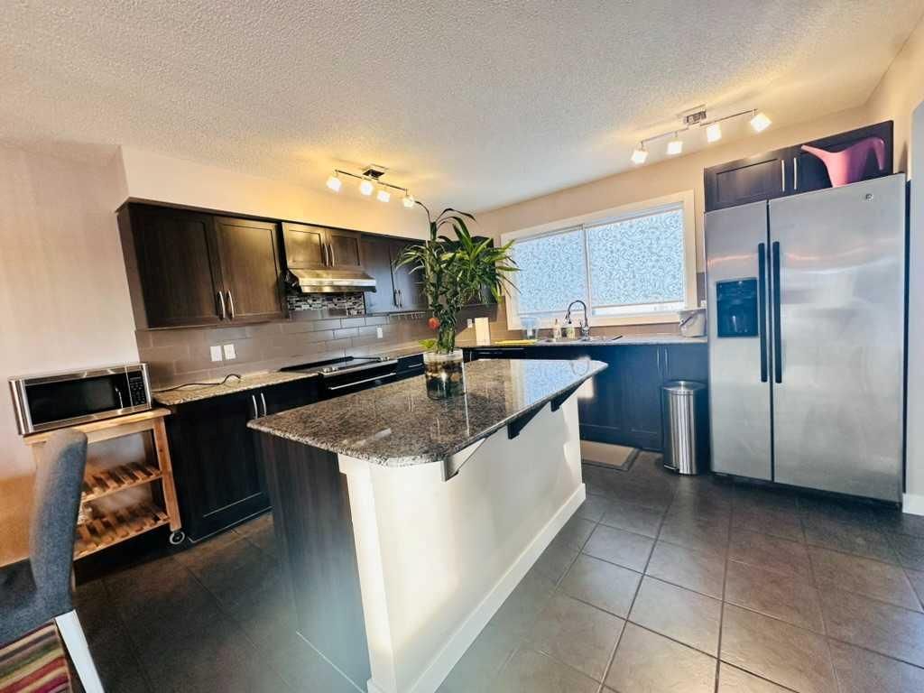 Photo of 225 panatella Square NW, Calgary, AB T3K 0V5 (MLS # A2233986)