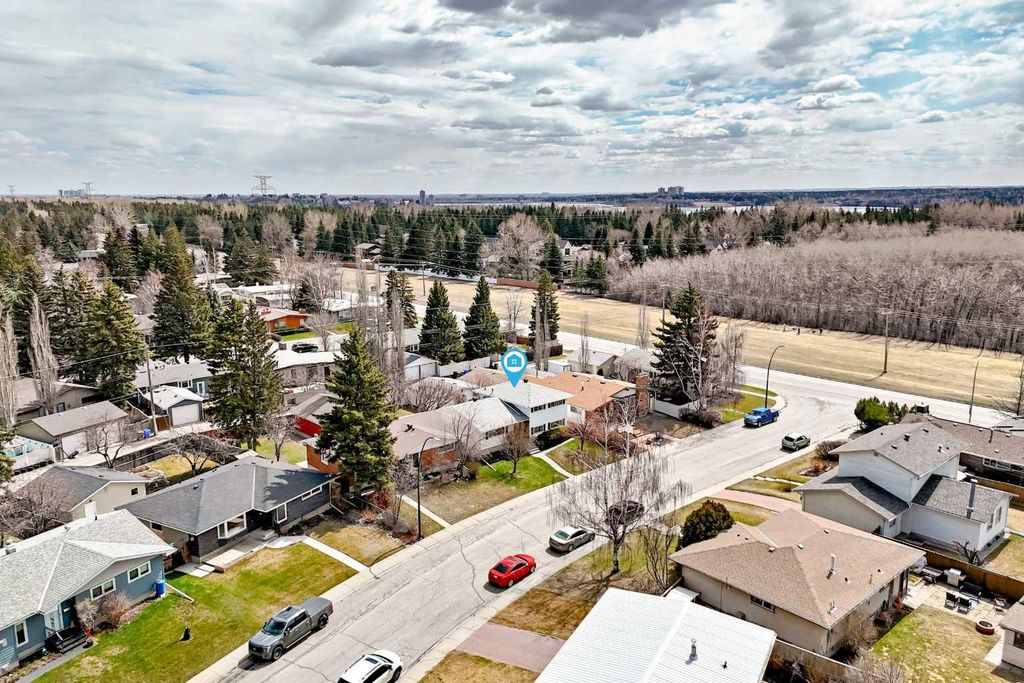 Photo of 6612 Longmoor Way SW, Calgary, AB T3E 5Z9 (MLS # A2306580)