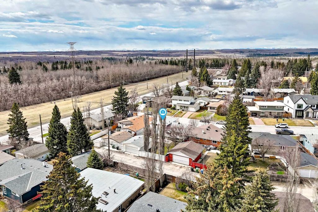 Photo of 6612 Longmoor Way SW, Calgary, AB T3E 5Z9 (MLS # A2306580)