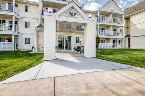 Photo of 309 Woodside Drive NW #307, Airdrie, AB T4B 2E7 (MLS # A2330737)