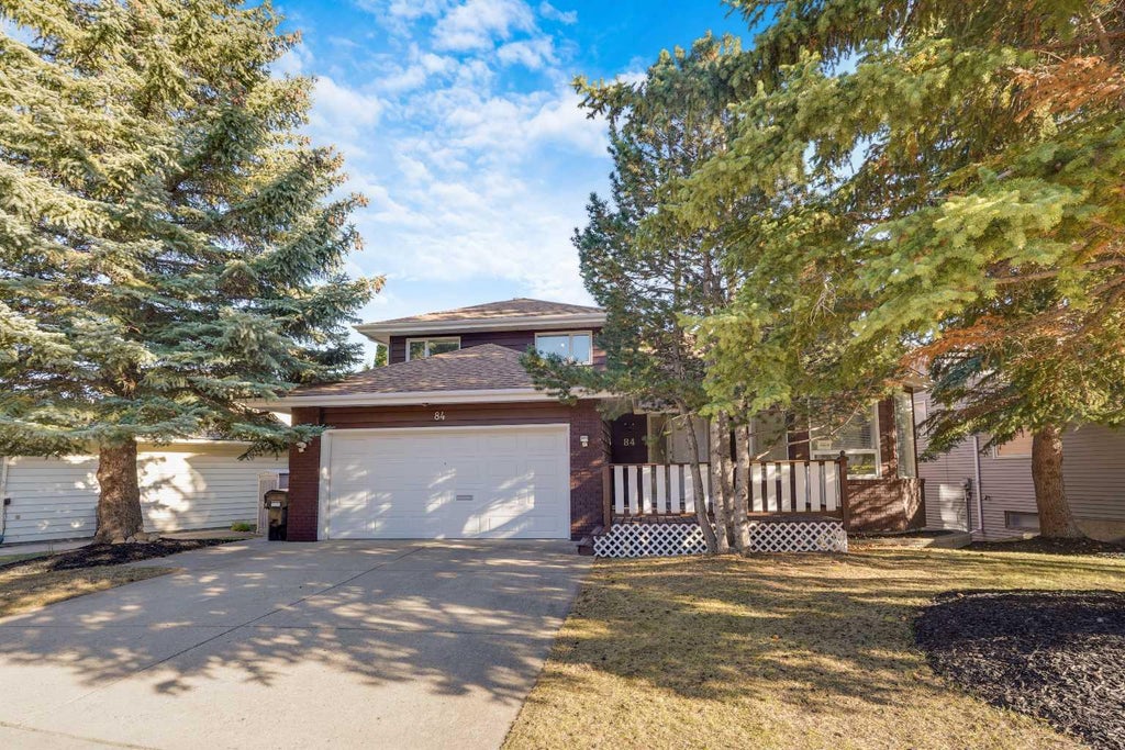 Photo of 84 Strathlorne Crescent SW, Calgary, AB T3H 1M8 (MLS # A2353985)