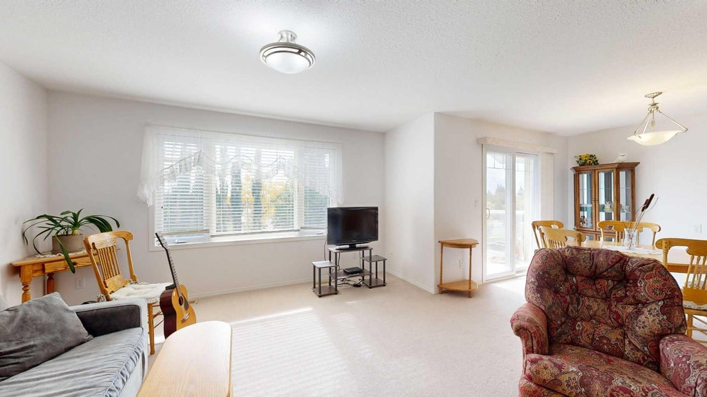 Photo of 5402 50 Avenue #303, Stettler, AB T4K 1K9 (MLS # A2348130)