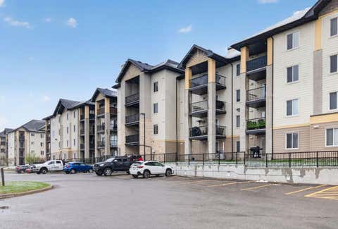 Photo of 304 Mackenzie Way SW #7103, Airdrie, AB T4B 3H7 (MLS # A2310904)