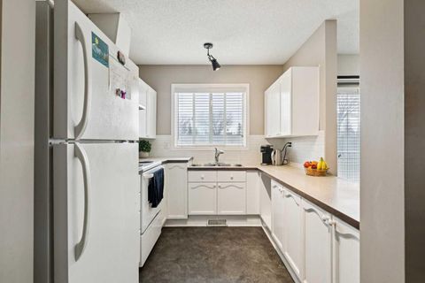 Photo of 7 Harvest Gold Manor NE #104, Calgary, AB T3K 4Y3 (MLS # A2285324)