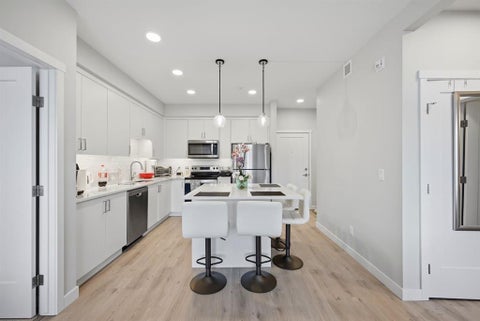 Photo of 660 Shawnee Square SW #104, Calgary, AB T2Y 2N6 (MLS # A2318630)
