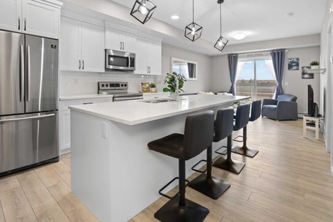 Photo of 370 Harvest Hills Common NE #406, Calgary, AB T3K 2M8 (MLS # A2285239)