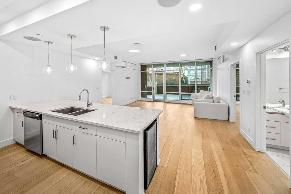 Photo of 530 12 Avenue SW #203, Calgary, AB T2R 0B1 (MLS # A2351483)