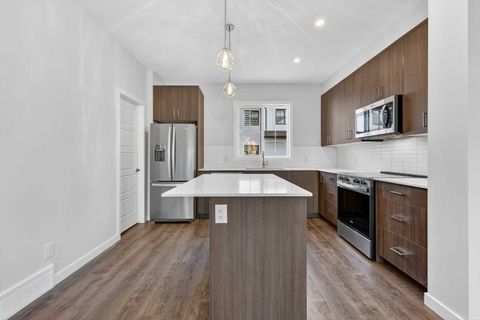 Photo of 40 Creekside Way SW #105, Calgary, AB T2X 6E2 (MLS # A2315872)
