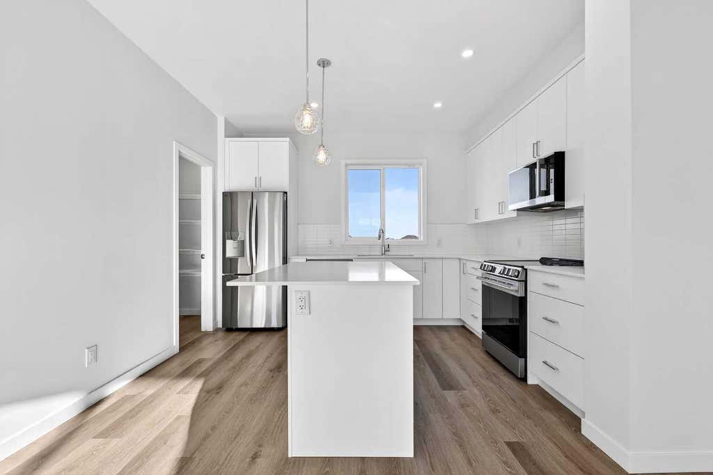 Photo of 12 Hotchkiss Parade SE, Calgary, AB T3S 0X5 (MLS # A2335561)