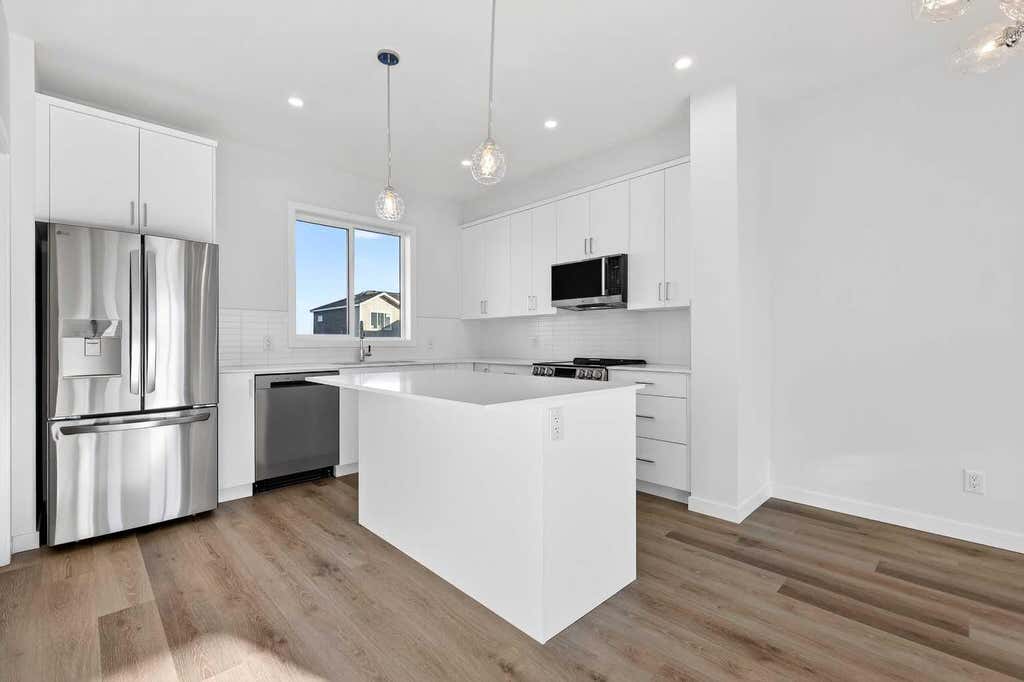 Photo of 12 Hotchkiss Parade SE, Calgary, AB T3S 0X5 (MLS # A2335561)