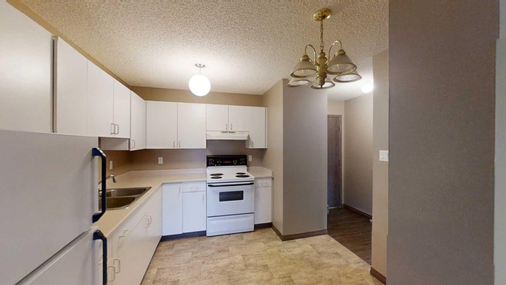 Photo of 5117 44 Street #206, High Prairie, AB T0G 1E0 (MLS # A2339852)