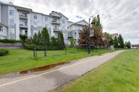 Photo of 8 Country Village Bay NE #101, Calgary, AB T3K 5J7 (MLS # A2325558)