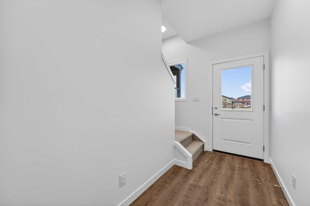 Photo of 28 Red Embers Plaza NE #103, Calgary, AB T3N 2W1 (MLS # A2296301)