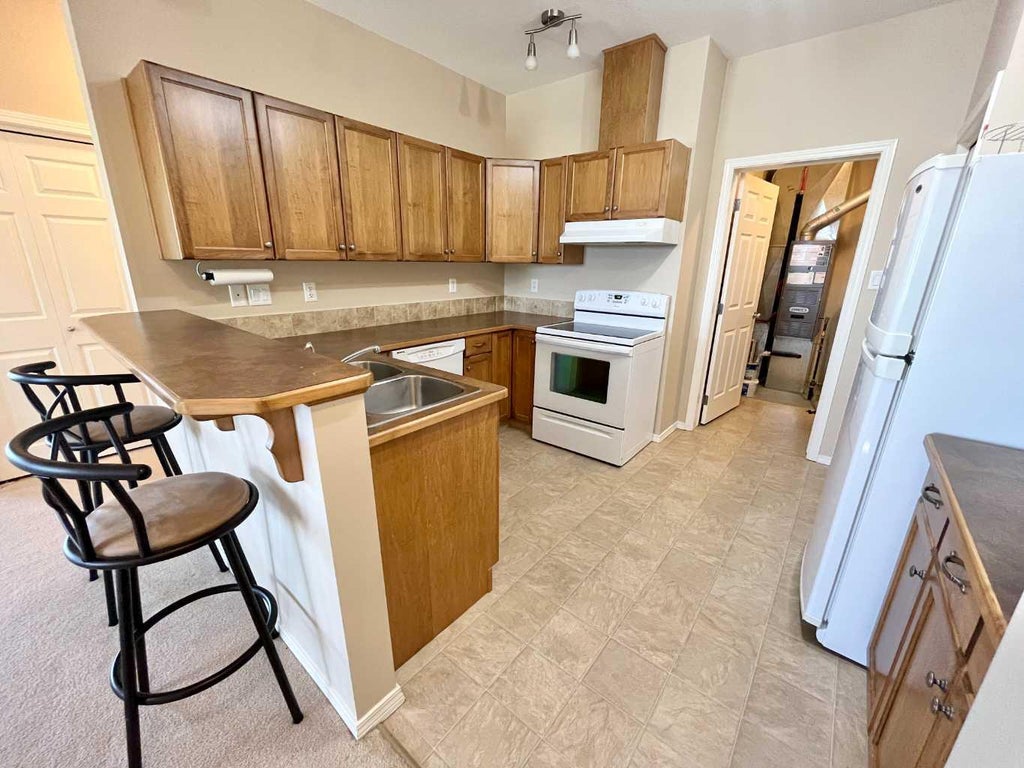 Photo of 137 Silkstone Road W #7, Lethbridge, AB T1J 3H6 (MLS # A2327820)
