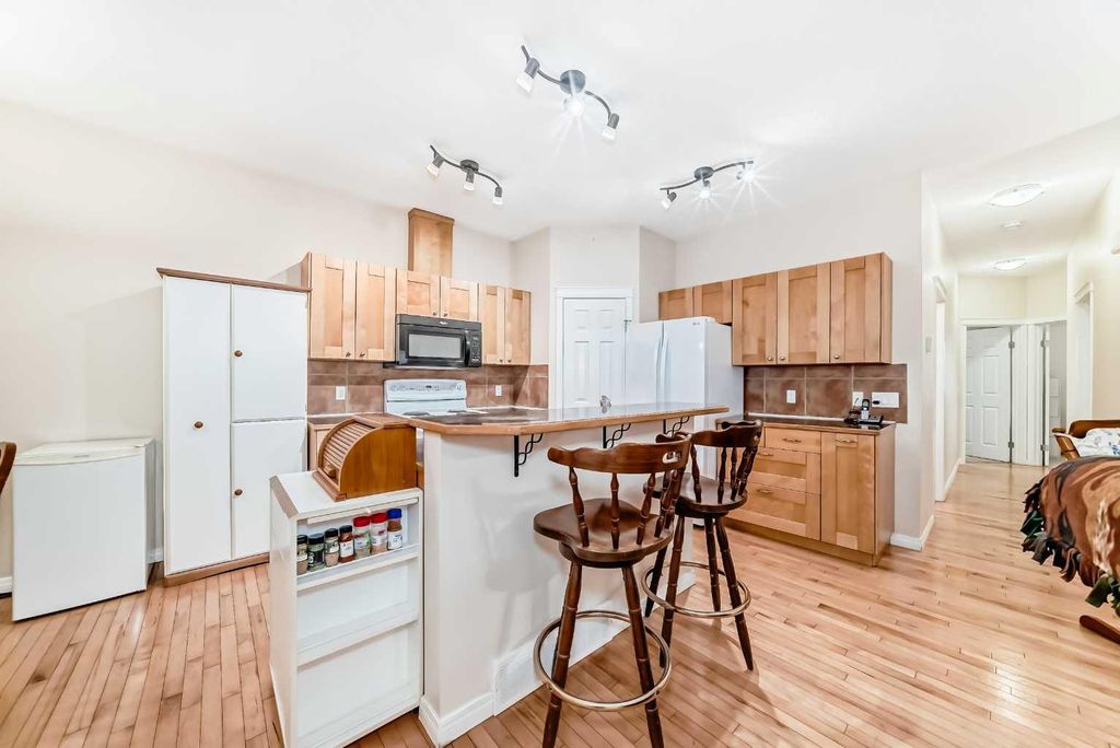 Photo of 746 Carriage Lane Drive, Carstairs, AB T0M 0N0 (MLS # A2300163)