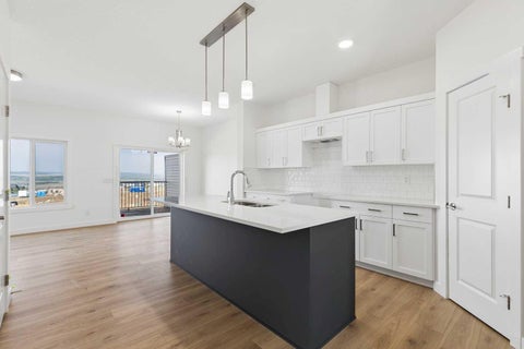 Photo of 27 Heritage Point, Cochrane, AB T4C 0L3 (MLS # A2341866)