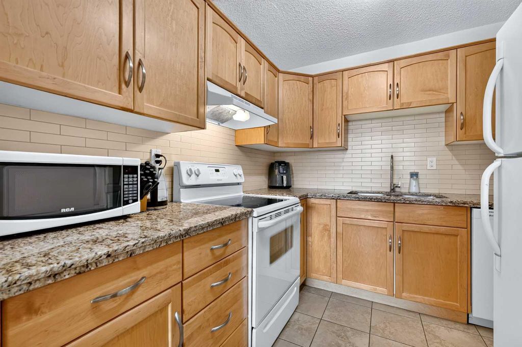 Photo of 1123 13 Avenue SW #502, Calgary, AB T2R 0L7 (MLS # A2322168)