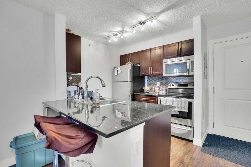 Photo of 15 Saddlestone Way NE #411, Calgary, AB T3J 0S3 (MLS # A2281617)