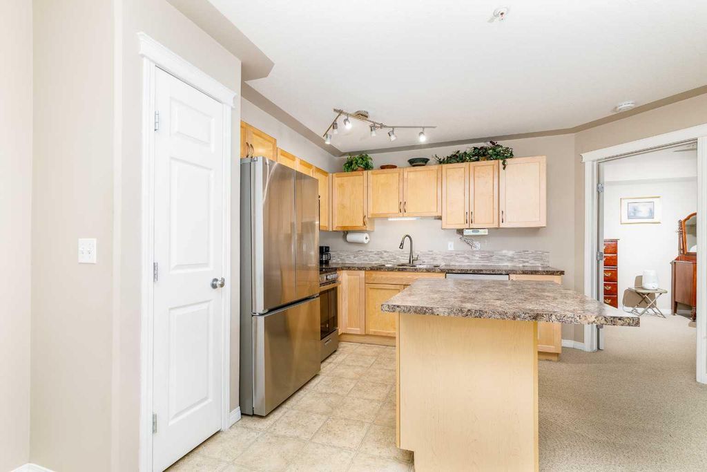 Photo of 5601 KERRY WOOD Drive #303, Red Deer, AB T4N 4X3 (MLS # A2328043)