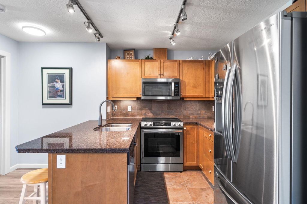 Photo of 30 Cranfield Link SE #206, Calgary, AB T3M 0C4 (MLS # A2310498)