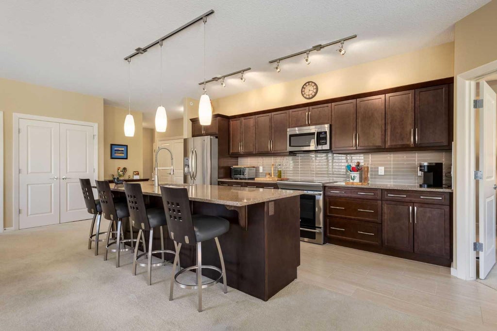 Photo of 103 Valley Ridge Manor NW #204, Calgary, AB T3B 6C5 (MLS # A2354115)