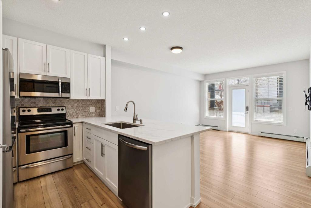 Photo of 10 Panatella Road NW #112, Calgary, AB T3K 0V4 (MLS # A2304815)