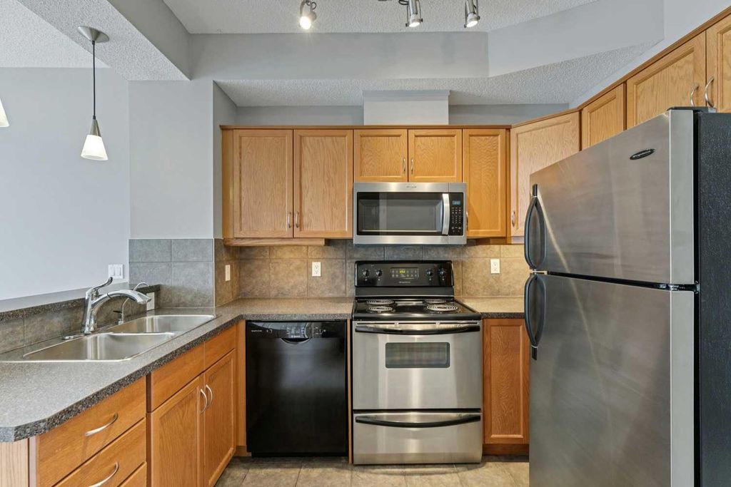 Photo of 133 Rockyledge View NW #14, Calgary, AB T3G 5X2 (MLS # A2302976)